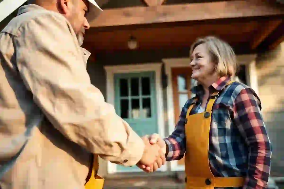 Contractor shaking hands with a homeowner